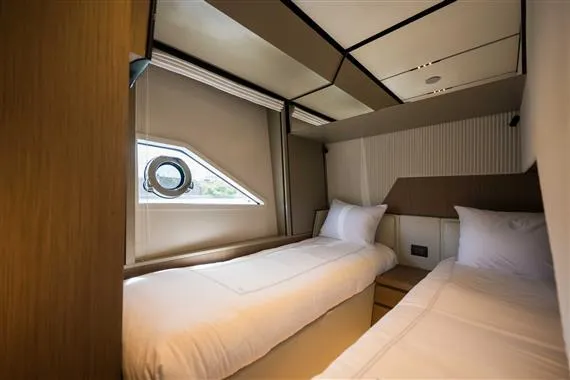  Yacht Photos Pics Luxurious twin cabin in 2023 Ferretti Yachts 720, featuring modern design and comfort.