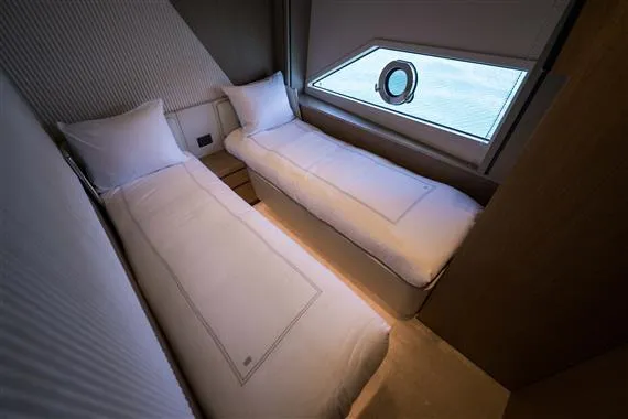  Yacht Photos Pics Twin beds in a luxurious 2023 Ferretti Yachts 720 cabin with ocean view.