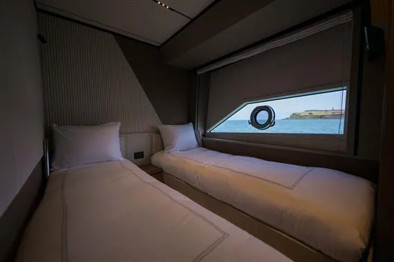  Yacht Photos Pics Twin bed cabin interior of 2023 Ferretti Yachts 720 with ocean view.