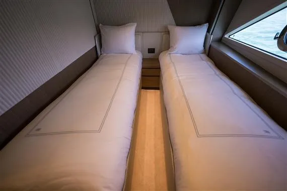  Yacht Photos Pics Twin beds in a luxurious 2023 Ferretti Yachts 720 cabin interior.