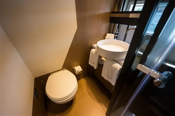  Yacht Photos Pics Luxurious bathroom in 2023 Ferretti Yachts 720, featuring modern fixtures and elegant design.