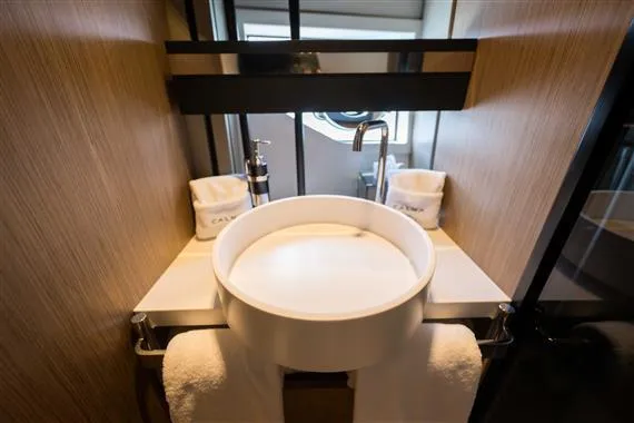 Yacht Photos Pics Luxurious bathroom sink in 2023 Ferretti Yachts 720, featuring modern design and elegant fixtures.