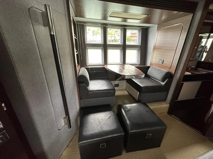 B-enjoy III Yacht Photos Pics Interior seating area of 2012 Azimut 72S yacht with modern furnishings and large windows.