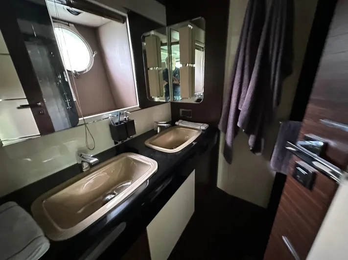 B-enjoy III Yacht Photos Pics Luxurious bathroom in a 2012 Azimut 72S yacht with dual sinks and modern fixtures.