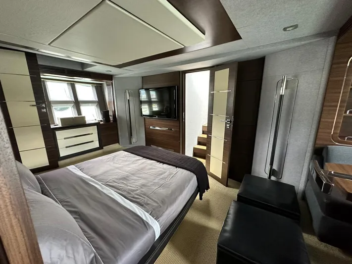 B-enjoy III Yacht Photos Pics Luxurious bedroom interior of 2012 Azimut 72S yacht with modern furnishings.
