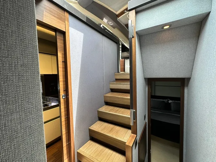 B-enjoy III Yacht Photos Pics Interior stairway of 2012 Azimut 72S yacht with modern design and wooden steps.