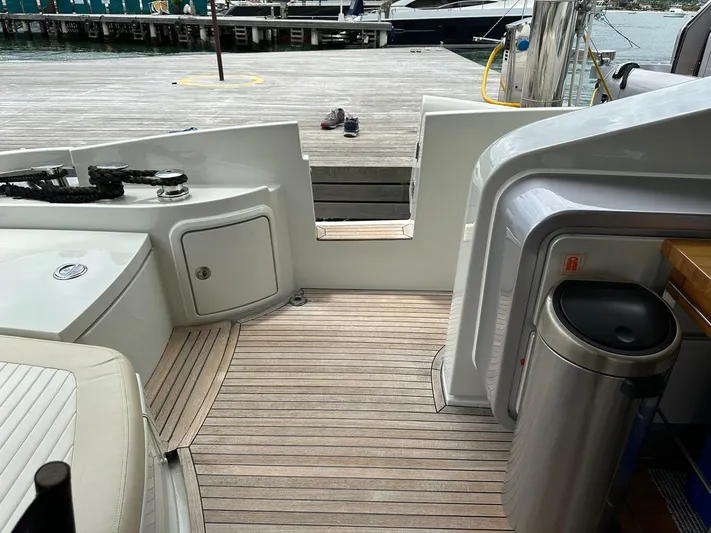 B-enjoy III Yacht Photos Pics Azimut 72S 2012 yacht deck with wooden flooring and dock access.
