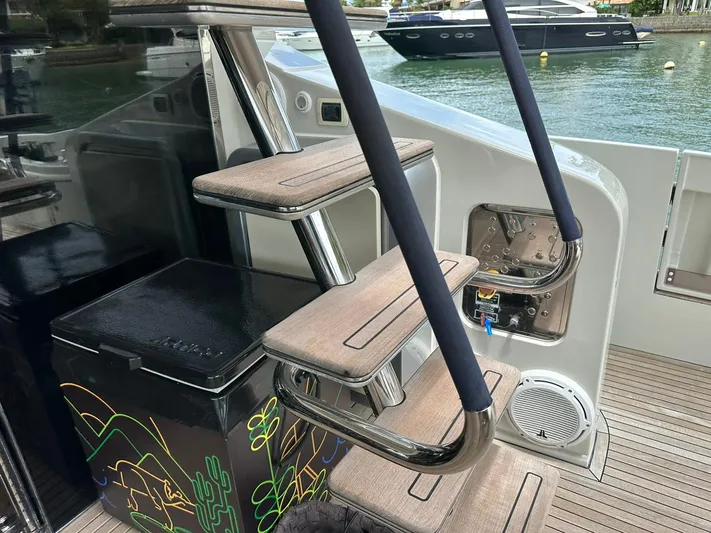 B-enjoy III Yacht Photos Pics Staircase on a 2012 Azimut 72S yacht with a view of the water.