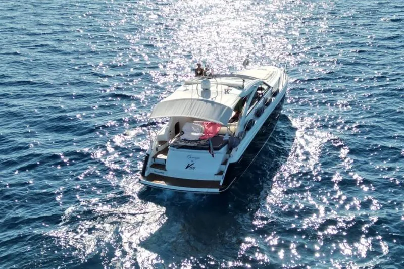  Yacht Photos Pics Luxury 2016 Princess V45 yacht cruising on sparkling blue ocean waters.