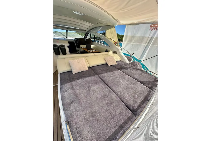  Yacht Photos Pics 2016 Princess V45 yacht interior with plush seating and cushions.