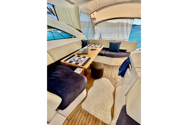  Yacht Photos Pics Luxurious interior of 2016 Princess V45 yacht with elegant seating and sea view.