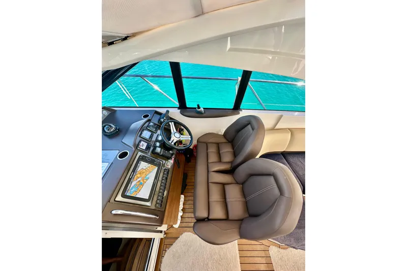  Yacht Photos Pics Luxurious 2016 Princess V45 yacht helm with leather seats and navigation system.