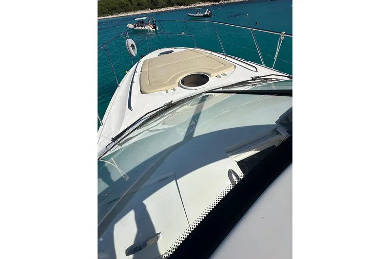  Yacht Photos Pics 2016 Princess V45 yacht on turquoise water, featuring sleek deck design.