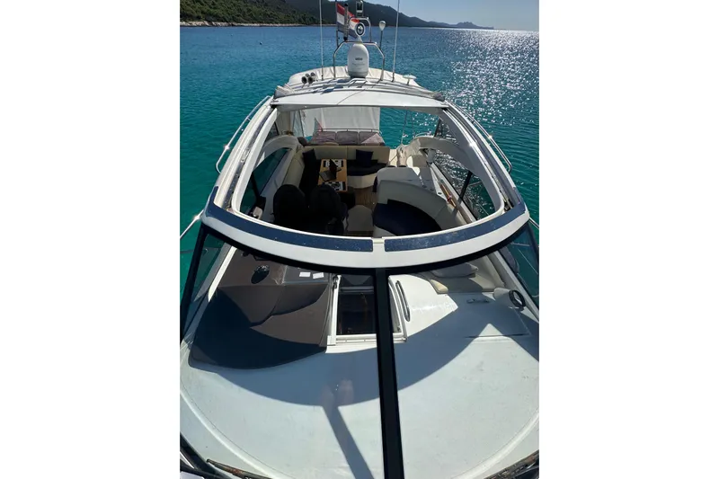  Yacht Photos Pics 2016 Princess V45 yacht on clear blue water, showcasing sleek design and luxury features.
