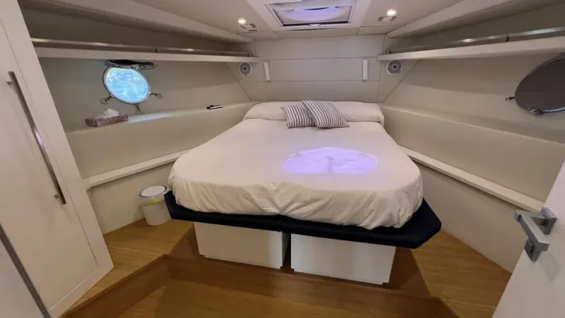  Yacht Photos Pics Luxurious cabin interior of 2016 Rio Yachts Colorado 56 with cozy bed and modern design.
