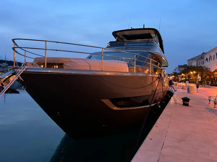  Yacht Photos Pics Luxury 2024 Cranchi Sessantasette 67 yacht docked at sunset.