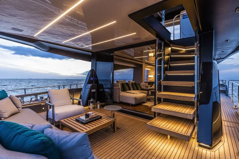  Yacht Photos Pics Luxurious 2024 Cranchi Sessantasette 67 yacht interior with elegant seating and ambient lighting.