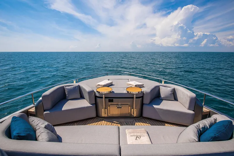  Yacht Photos Pics Luxurious 2024 Cranchi Sessantasette 67 yacht deck with elegant seating and ocean view.