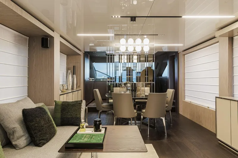  Yacht Photos Pics Luxurious interior of 2024 Cranchi Sessantasette 67 yacht with modern dining area and elegant decor.