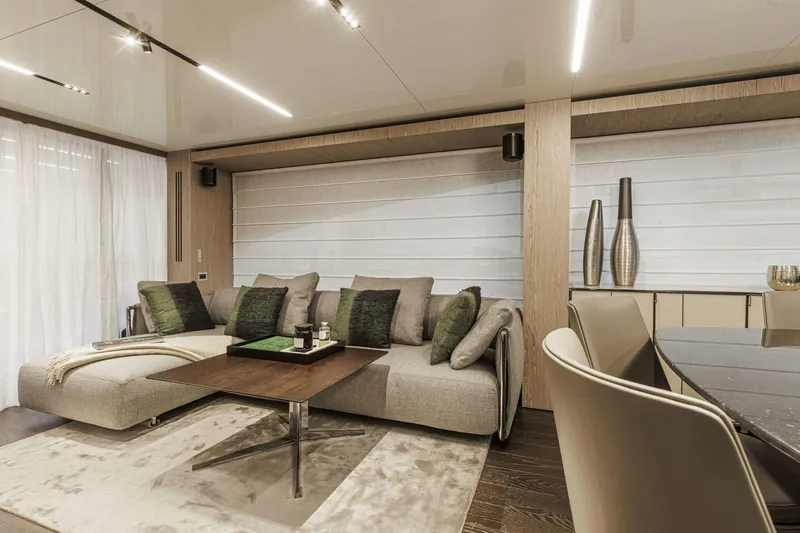  Yacht Photos Pics Luxurious interior of 2024 Cranchi Sessantasette 67 yacht with modern decor and comfortable seating.