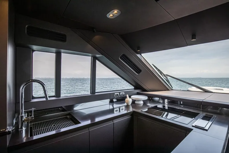  Yacht Photos Pics Luxurious kitchen interior of 2024 Cranchi Sessantasette 67 yacht with ocean view.