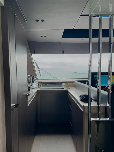  Yacht Photos Pics Modern kitchen interior of 2024 Cranchi Sessantasette 67 yacht with ocean view.
