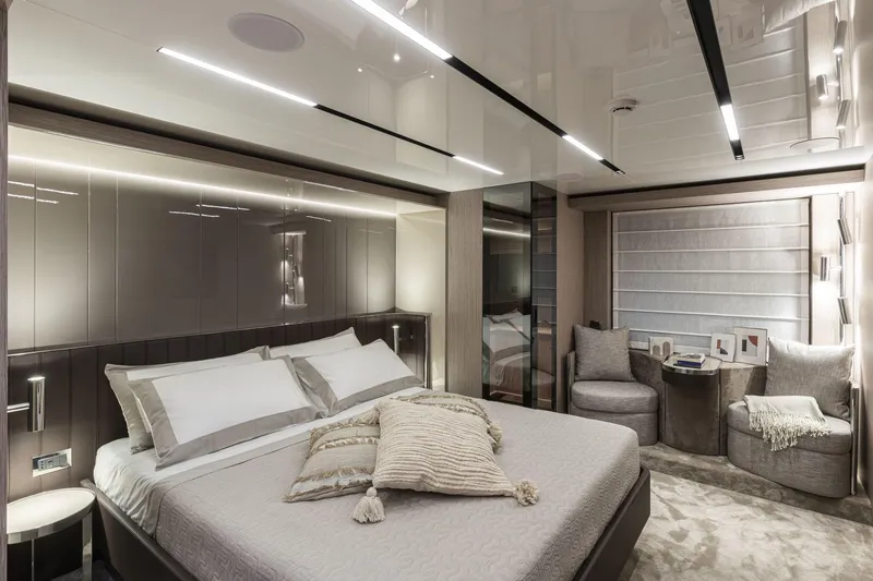  Yacht Photos Pics Luxurious bedroom interior of 2024 Cranchi Sessantasette 67 yacht, featuring modern design and elegant furnishings.
