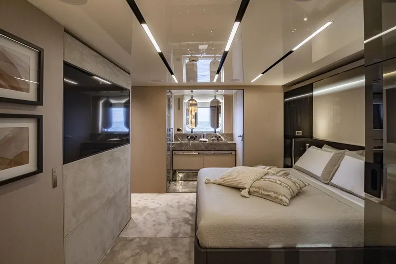  Yacht Photos Pics Luxurious 2024 Cranchi Sessantasette 67 yacht bedroom with modern decor and elegant furnishings.