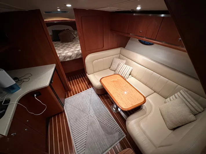  Yacht Photos Pics 2006 Tiara Yachts 3600 Open interior with cozy seating and wooden accents.