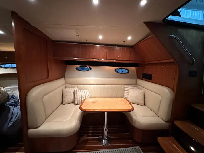  Yacht Photos Pics 2006 Tiara Yachts 3600 Open interior with cozy seating and wooden table.