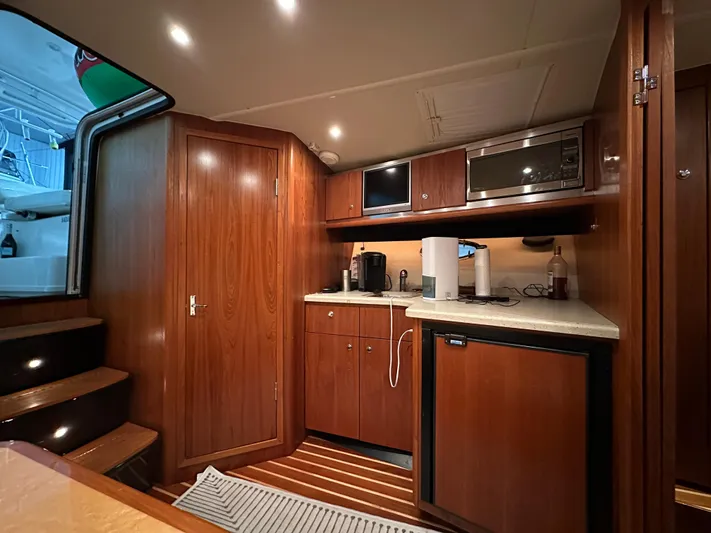  Yacht Photos Pics 2006 Tiara Yachts 3600 Open interior with wood cabinetry and modern kitchen amenities.