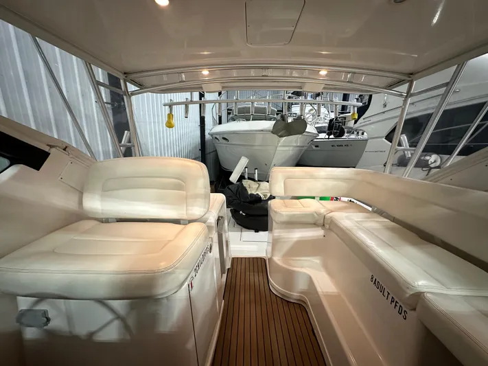  Yacht Photos Pics 2006 Tiara Yachts 3600 Open interior with white seating and wooden flooring.