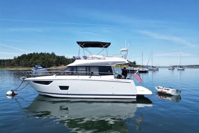 Sweet & Salty Yacht Photos Pics 2019 Jeanneau Velasco 37F yacht on calm water with scenic background.