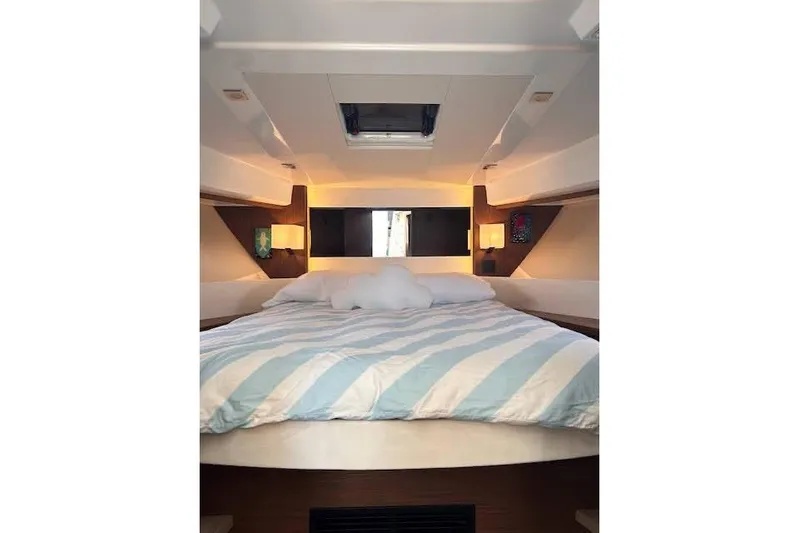 Sweet & Salty Yacht Photos Pics Interior cabin of 2019 Jeanneau Velasco 37F with cozy bed and modern lighting.