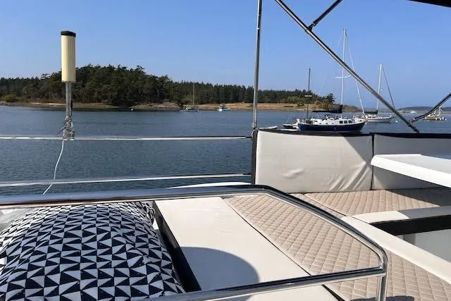 Sweet & Salty Yacht Photos Pics 2019 Jeanneau Velasco 37F yacht with scenic waterfront view and comfortable seating.