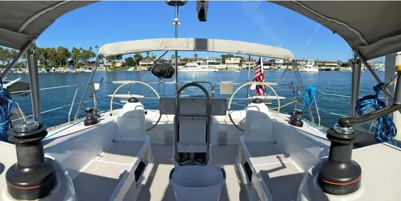 Yacht Photos Pics Sailboat cockpit view, Catalina 400, 1996 model, docked in a marina with clear blue skies.