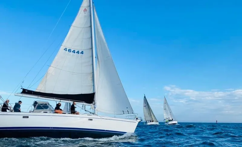  Yacht Photos Pics Sailboats on open sea, featuring a 1996 Catalina 400 under clear blue skies.