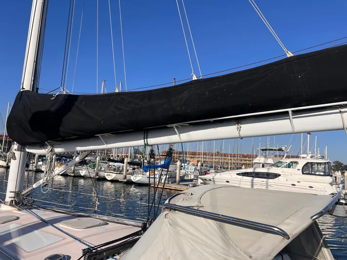  Yacht Photos Pics 1996 Catalina 400 sailboat docked in a marina under clear blue skies.