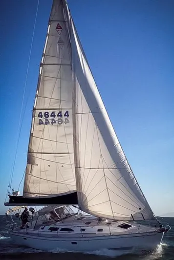  Yacht Photos Pics Sailing yacht Catalina 400, 1996 model, gliding on open water under clear blue sky.