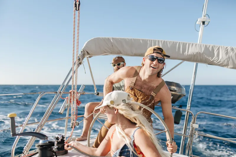  Yacht Photos Pics People sailing on a 1996 Catalina 400 yacht under clear blue skies.