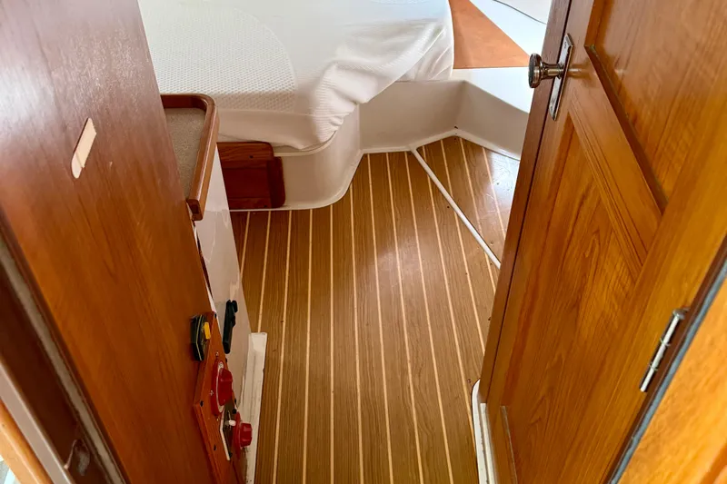  Yacht Photos Pics Interior of a 1996 Catalina 400 sailboat with wooden flooring and cozy cabin.