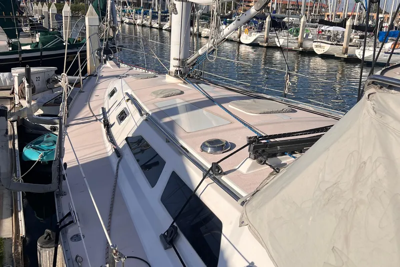  Yacht Photos Pics 1996 Catalina 400 sailboat docked at marina, showcasing deck and rigging.
