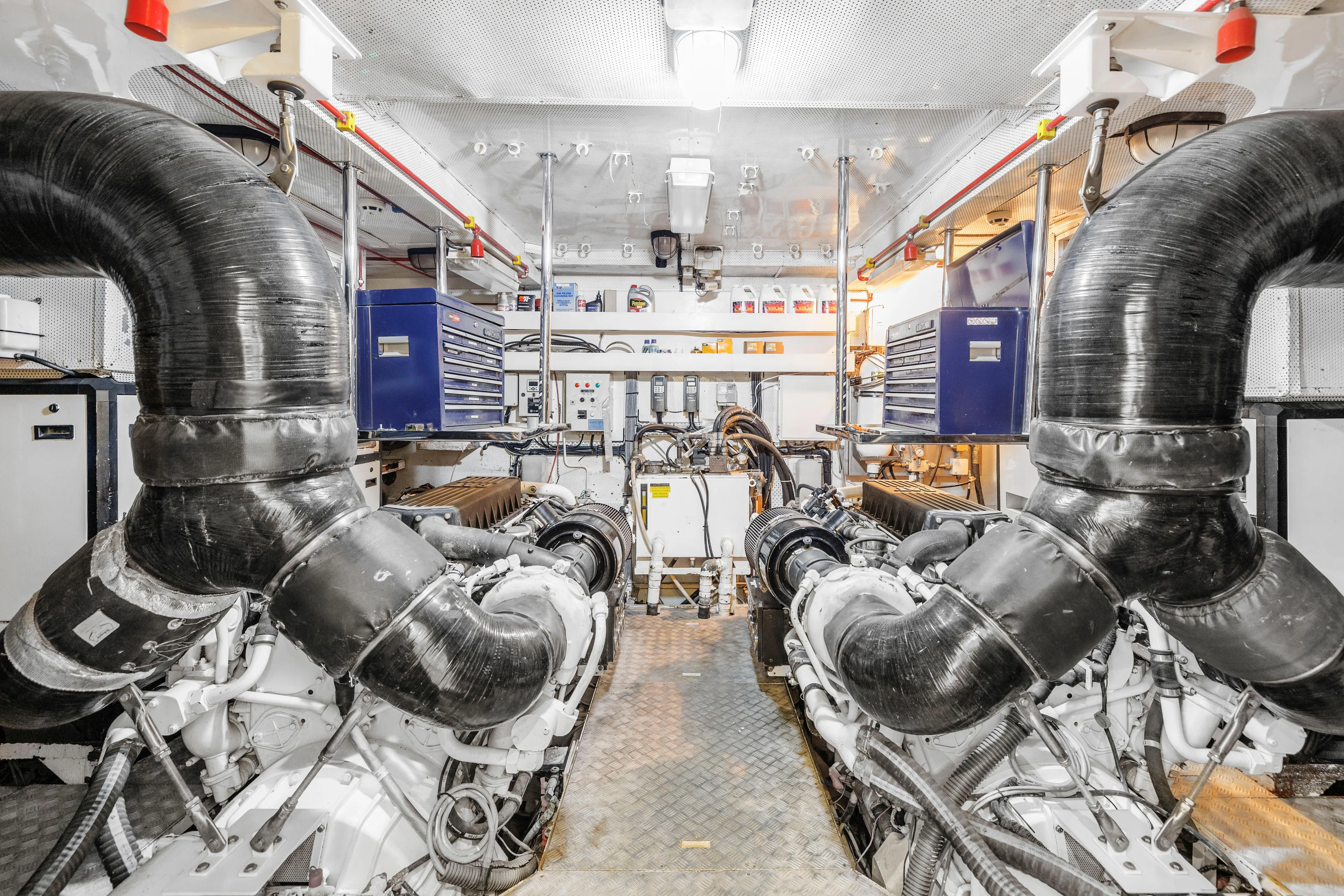 Star Saphire Yacht Photos Pics Engine room of 2007 Bilgin 117 yacht with large exhaust pipes and equipment.