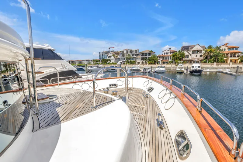 Star Saphire Yacht Photos Pics Luxurious 2007 Bilgin 117 yacht docked in a scenic marina with waterfront homes.