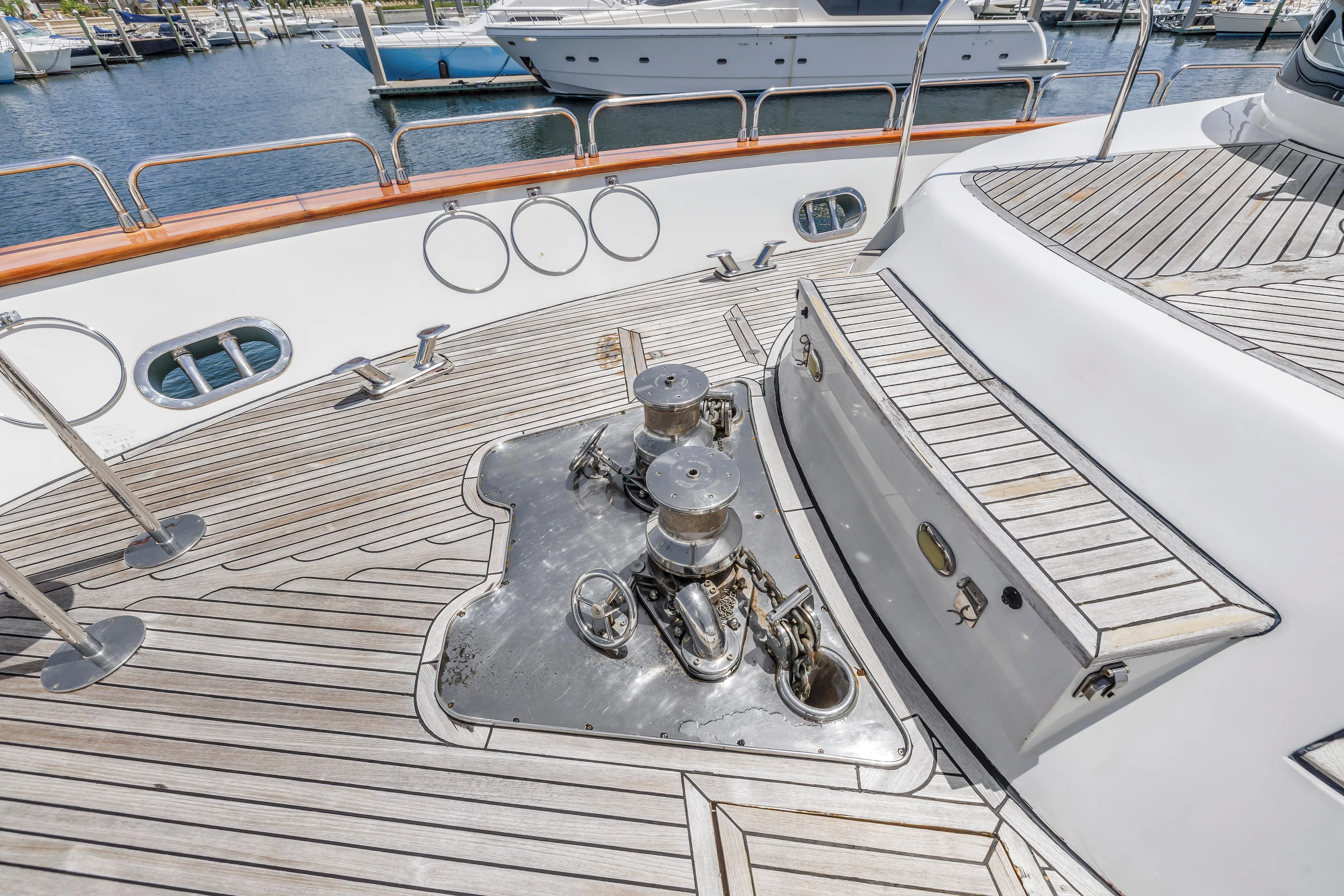 Star Saphire Yacht Photos Pics Deck of 2007 Bilgin 117 yacht with wooden flooring and metal fixtures.