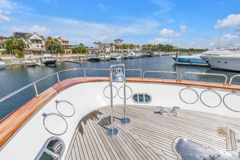 Star Saphire Yacht Photos Pics Luxury yacht Bilgin 117 (2007) docked in a scenic marina with waterfront homes.