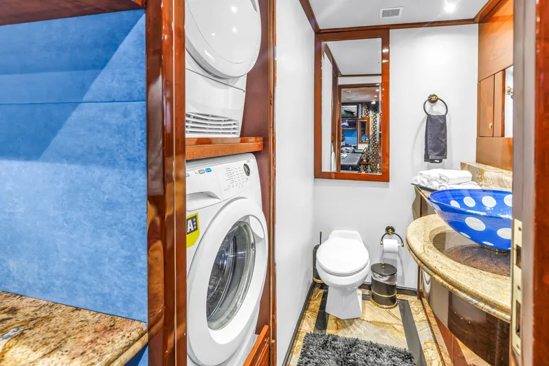 Star Saphire Yacht Photos Pics Luxurious Bilgin 117 yacht bathroom with washer, dryer, and stylish blue sink, 2007 model.