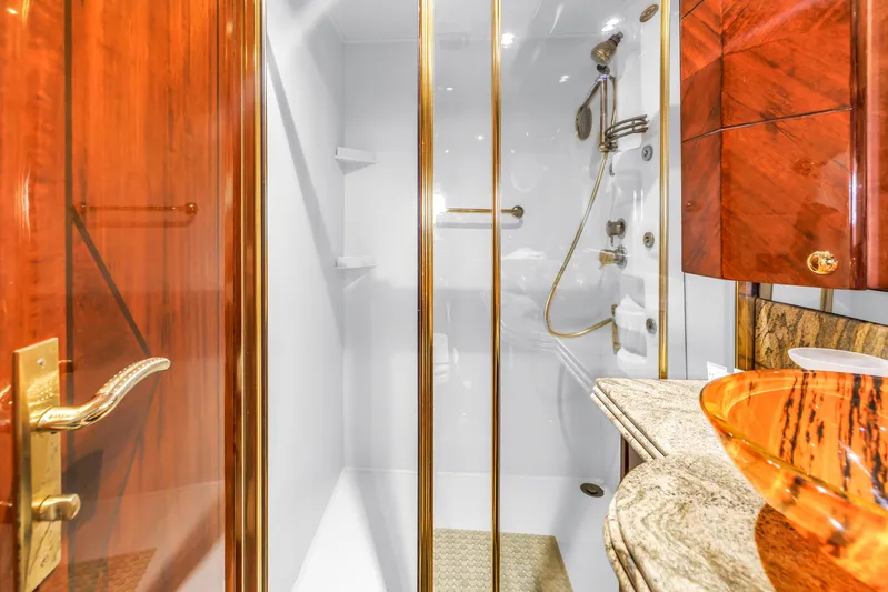 Star Saphire Yacht Photos Pics Luxurious yacht bathroom with glass shower, marble countertop, and elegant wood finishes, Bilgin 117, 2007.
