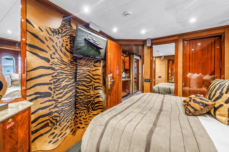 Star Saphire Yacht Photos Pics Luxurious Bilgin 117 yacht interior, featuring elegant wood finishes and animal print decor, 2007 model.