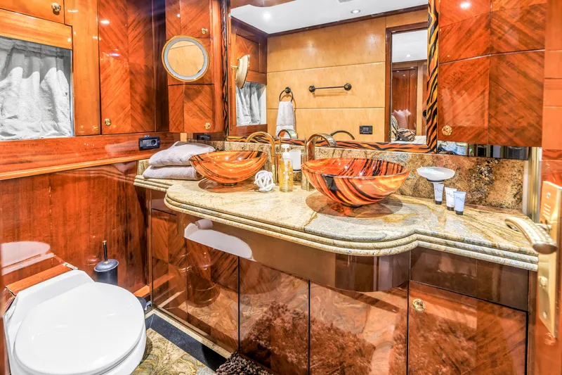 Star Saphire Yacht Photos Pics Luxurious Bilgin 117 yacht bathroom, 2007 model, featuring elegant wood finishes and stylish vessel sinks.